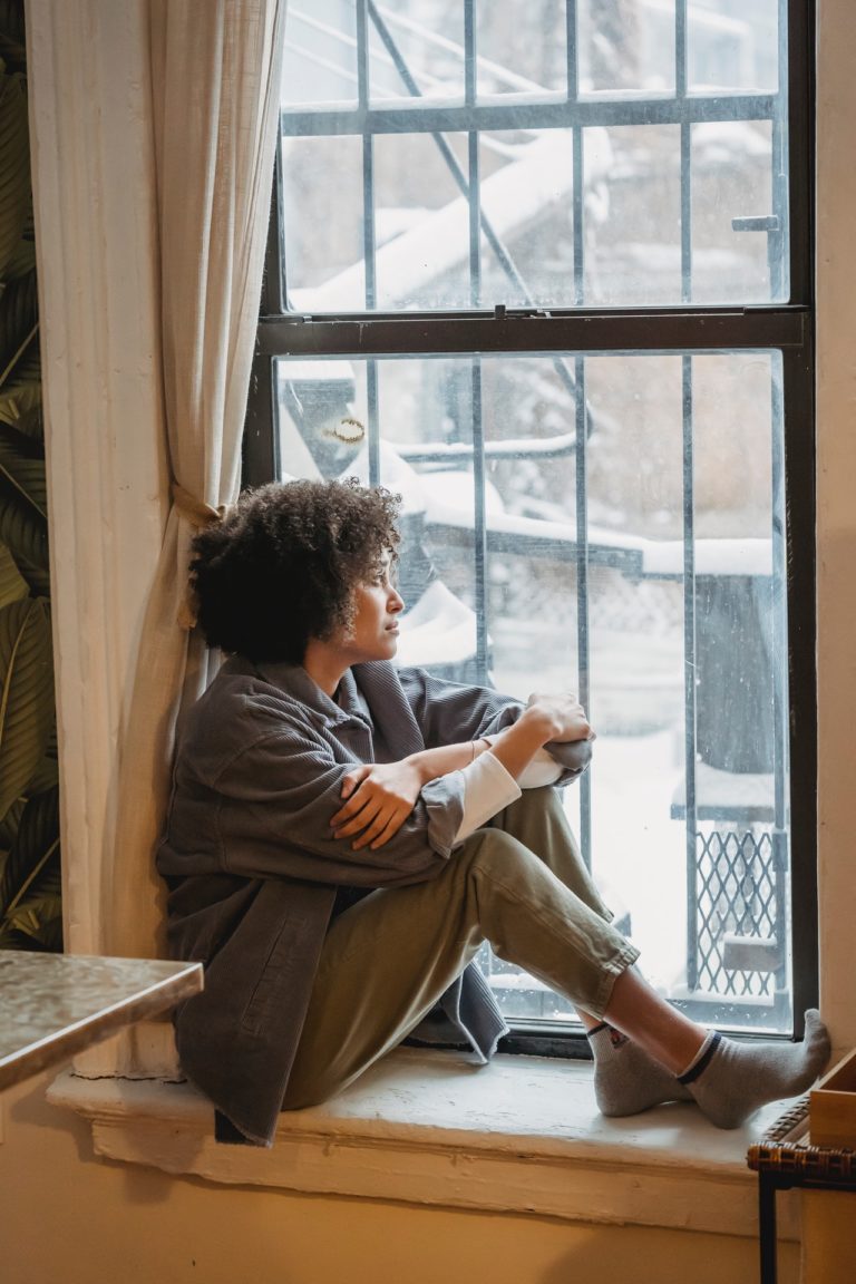 Person looking out the window in Nashville, TN