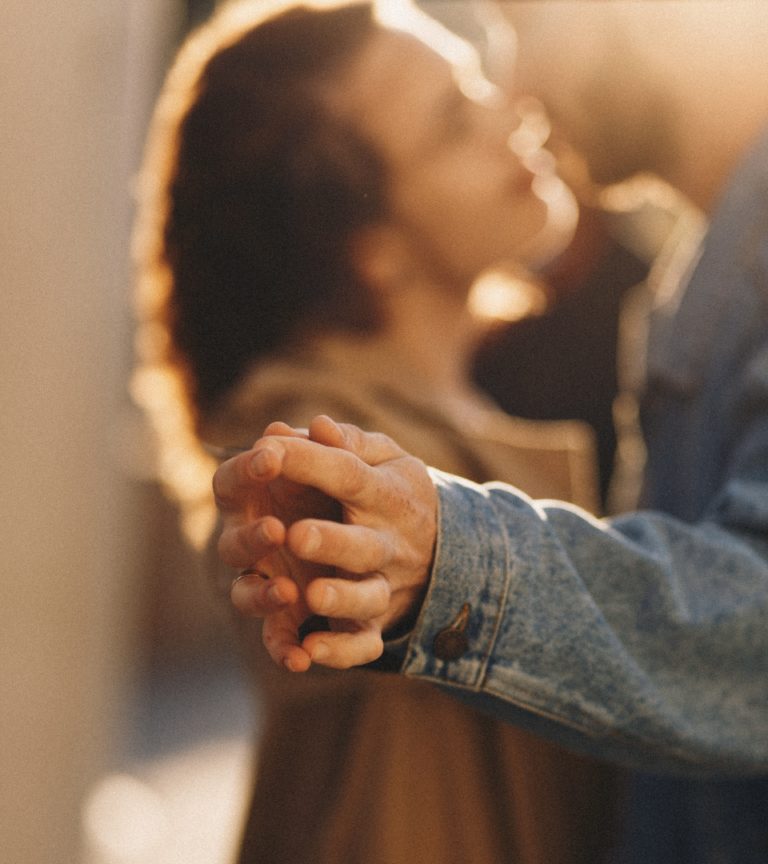 Couple dancing with their hands together