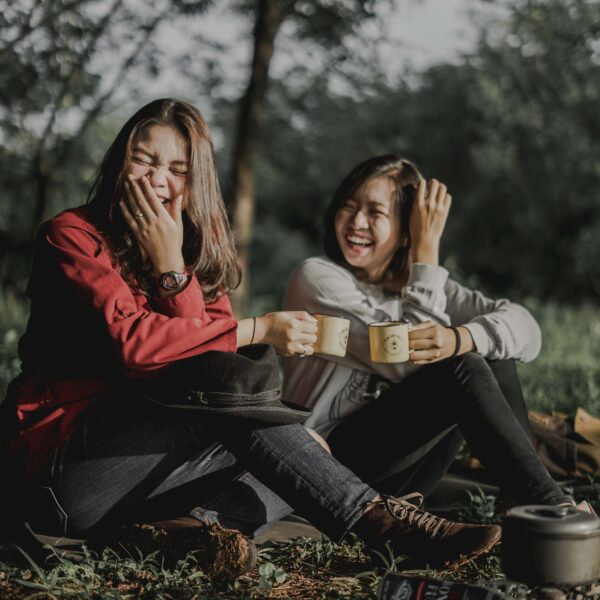 Two happy girls on a camping treat